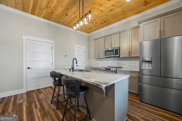 a view of cabinets and wooden floor