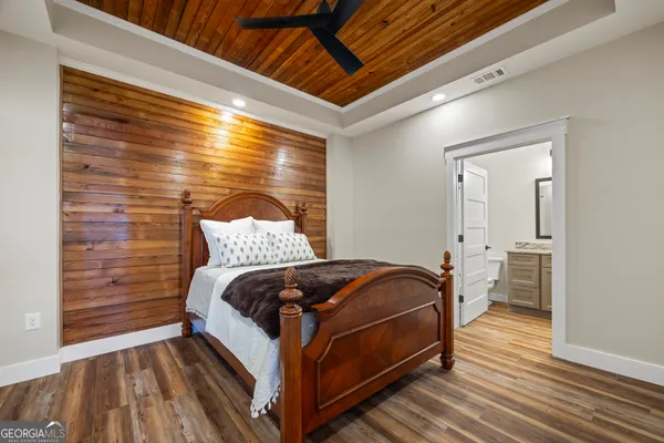 a bedroom with a bed and a view of bedroom