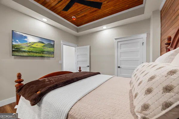 a bathroom with a granite countertop toilet sink and mirror