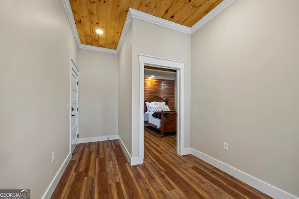 a view of walk in closet with empty racks