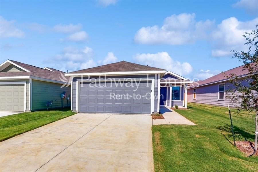 a view of a house with a yard