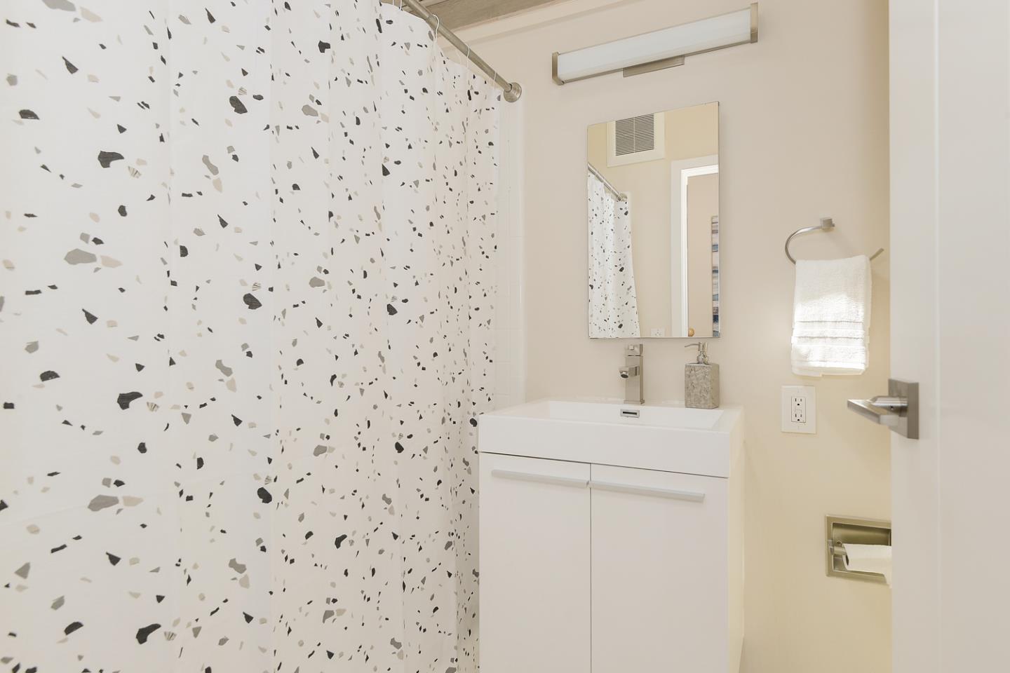 278 Monroe Drive, Unit 14 Mountain View, CA 94040 - Photo 11 of 20 a bathroom with a sink a toilet and shower