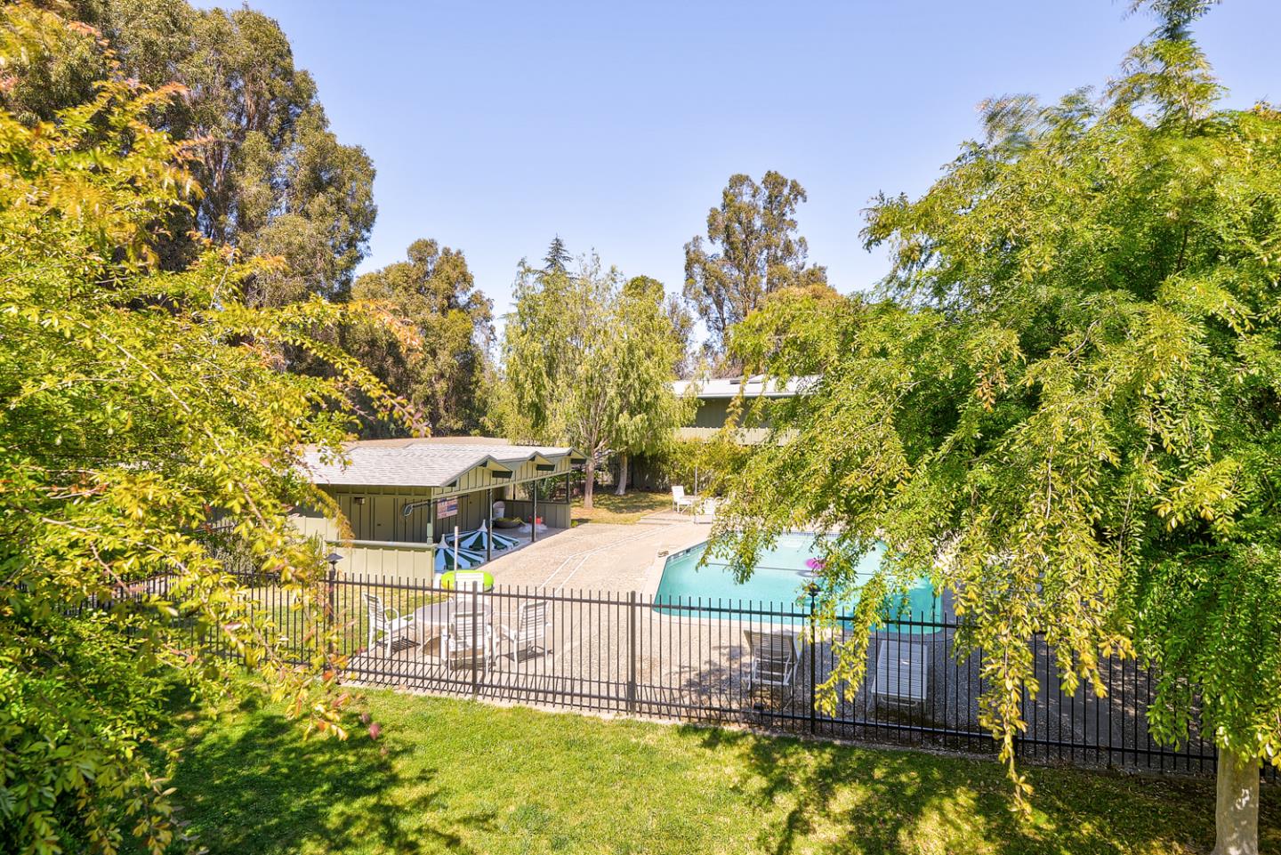 278 Monroe Drive, Unit 14 Mountain View, CA 94040 - Photo 13 of 20 a view of a swimming pool with a patio