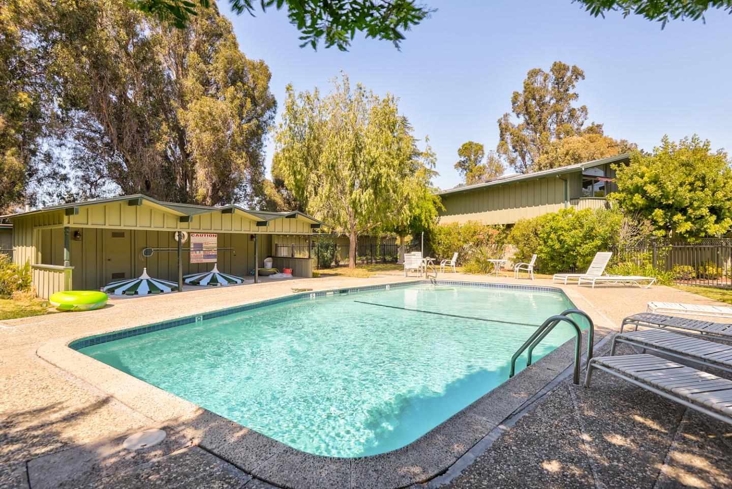 278 Monroe Drive, Unit 14 Mountain View, CA 94040 - Photo 16 of 20 a view of a swimming pool with a patio