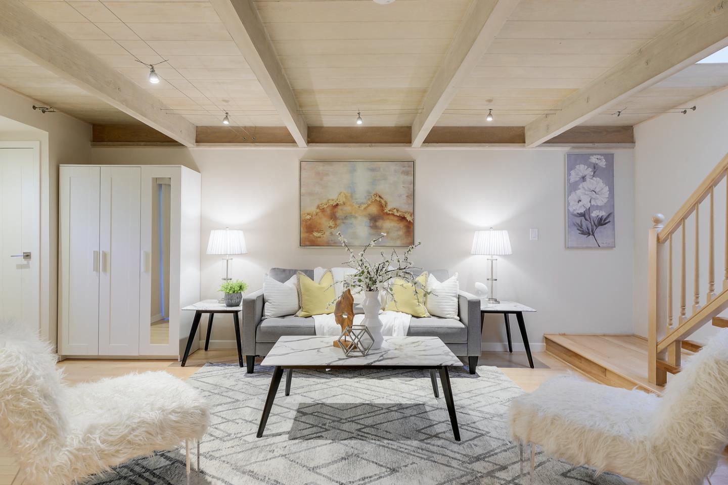 278 Monroe Drive, Unit 14 Mountain View, CA 94040 - Photo 2 of 20 a living room with furniture and a rug