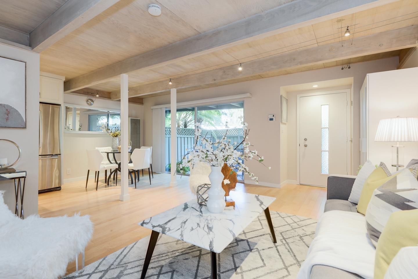 278 Monroe Drive, Unit 14 Mountain View, CA 94040 - Photo 3 of 20 a living room with furniture and a large window