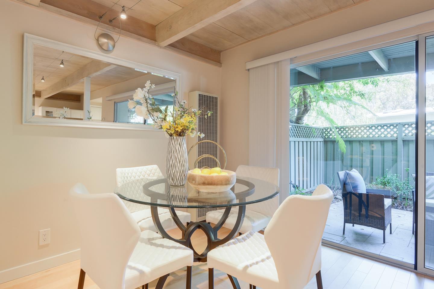 278 Monroe Drive, Unit 14 Mountain View, CA 94040 - Photo 5 of 20 a dining room with furniture and wooden floor