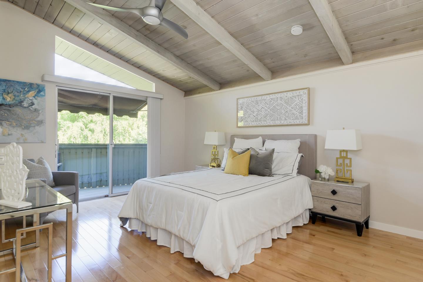 278 Monroe Drive, Unit 14 Mountain View, CA 94040 - Photo 9 of 20 a bedroom with a bed and wooden floor