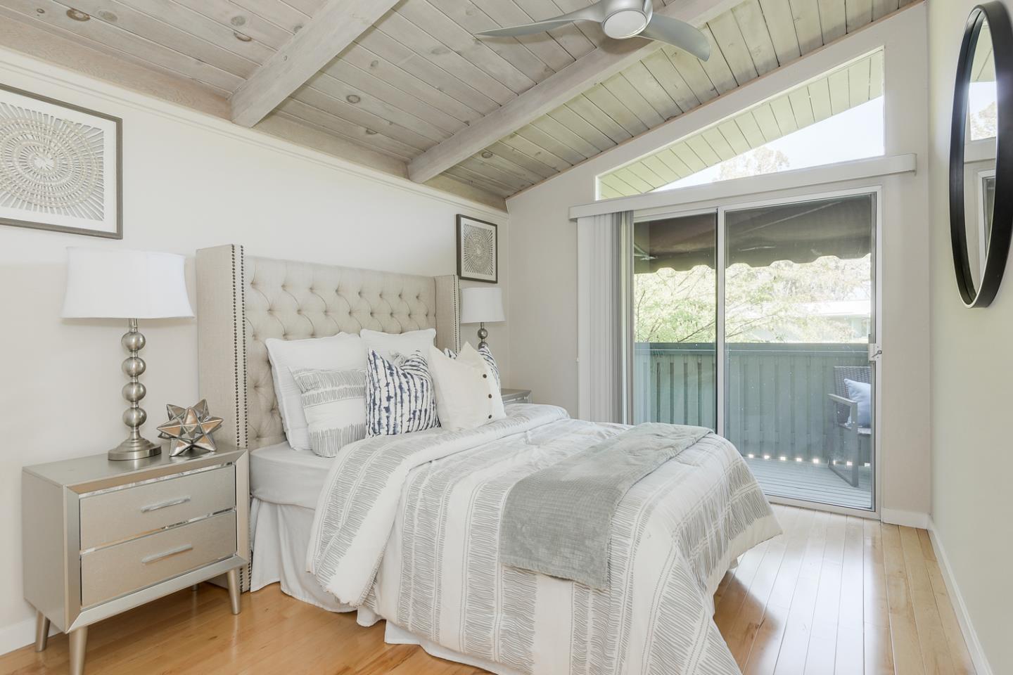 278 Monroe Drive, Unit 14 Mountain View, CA 94040 - Photo 10 of 20 a bedroom with a large bed and a window