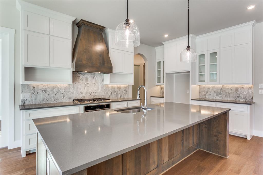 182 Fan Mill Trail Weatherford, TX 76085 - Photo 11 of 31 a kitchen with stainless steel appliances granite countertop a sink a stove and a refrigerator