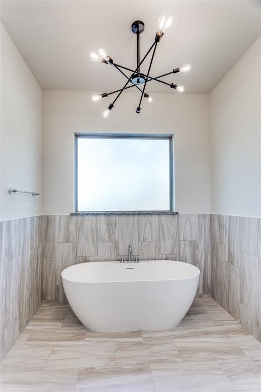 182 Fan Mill Trail Weatherford, TX 76085 - Photo 20 of 31 a view of a bathtub in a room