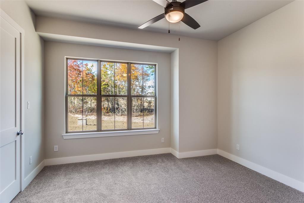 182 Fan Mill Trail Weatherford, TX 76085 - Photo 25 of 31 an empty room with a window and a fan