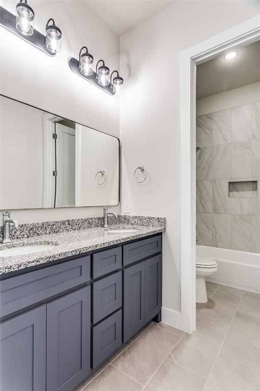 182 Fan Mill Trail Weatherford, TX 76085 - Photo 28 of 31 a bathroom with a granite countertop sink mirror and toilet