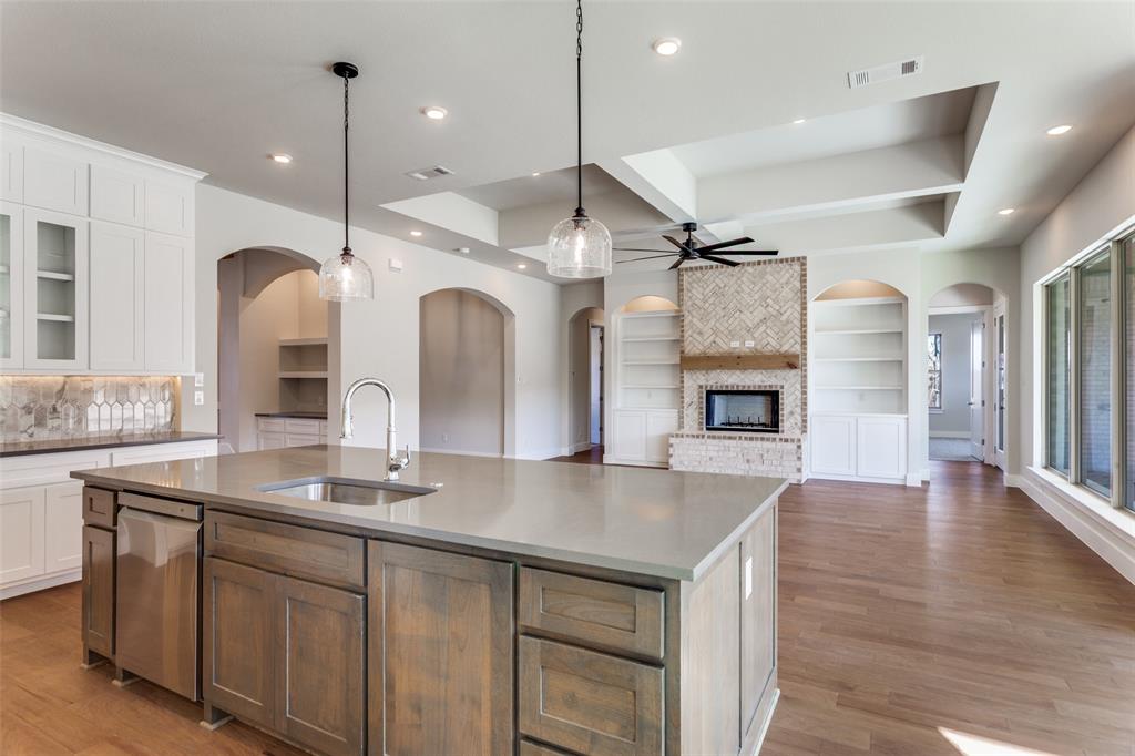 182 Fan Mill Trail Weatherford, TX 76085 - Photo 10 of 31 a large kitchen with a sink and a stove top oven
