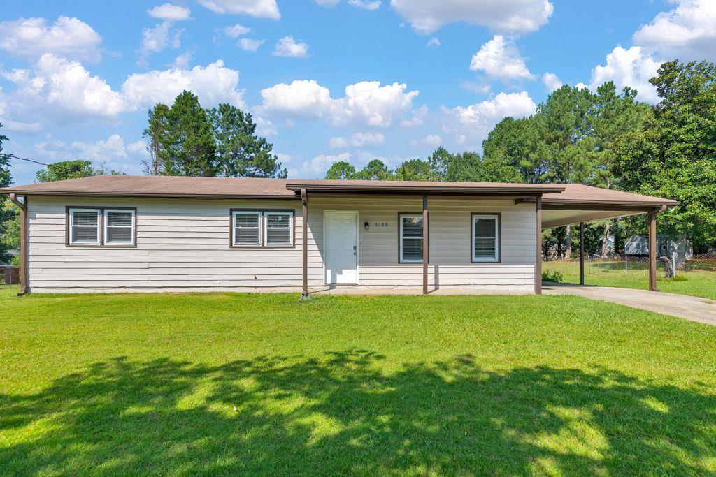 3188 Delhi Drive Powder Springs, GA 30127 - Photo 1 of 1 a front view of a house with a garden