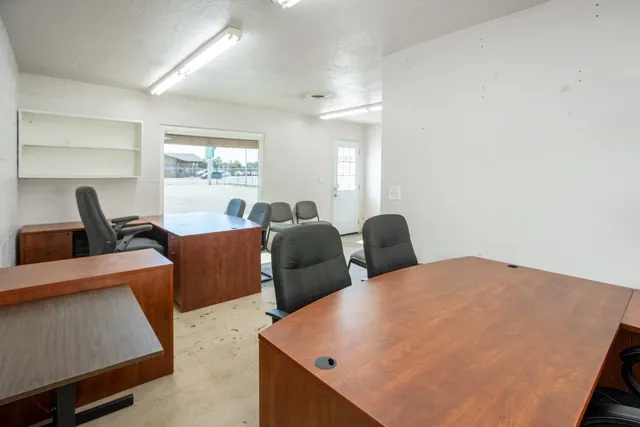 a bedroom with a workspace