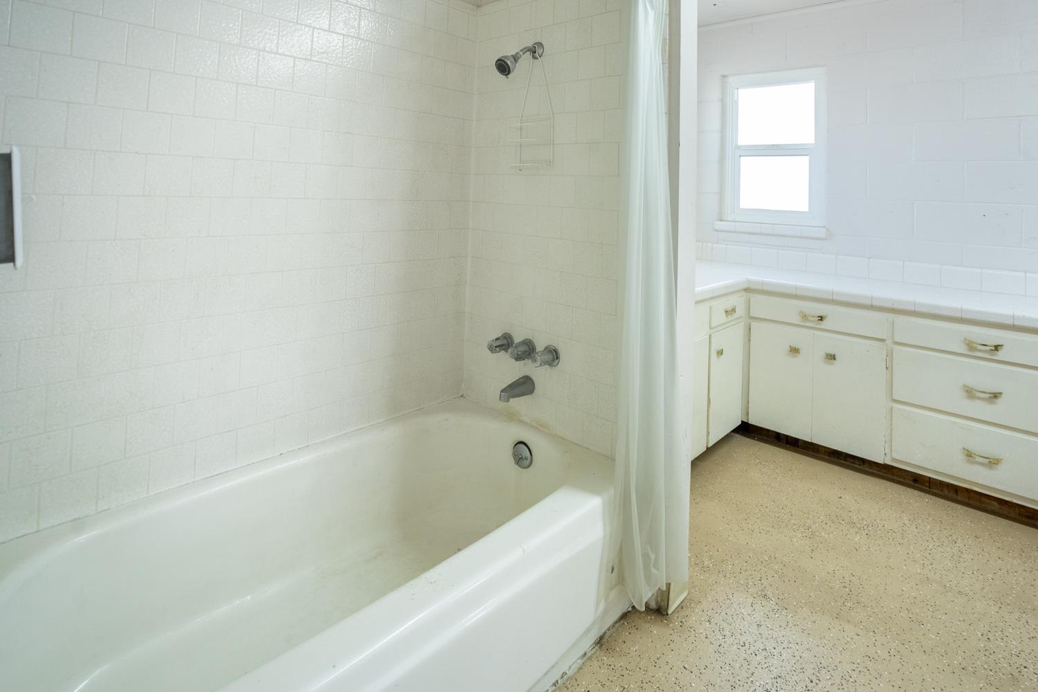 33 East Gridley Road Gridley, CA 95948 - Photo 28 of 53 a bathroom with a bathtub and a shower