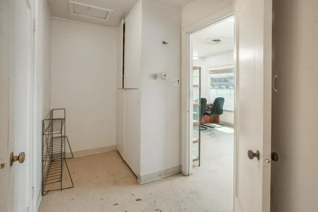 a bedroom with a bed and cabinets