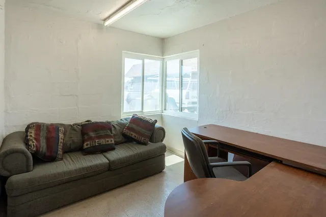 a kitchen with a refrigerator and a sink