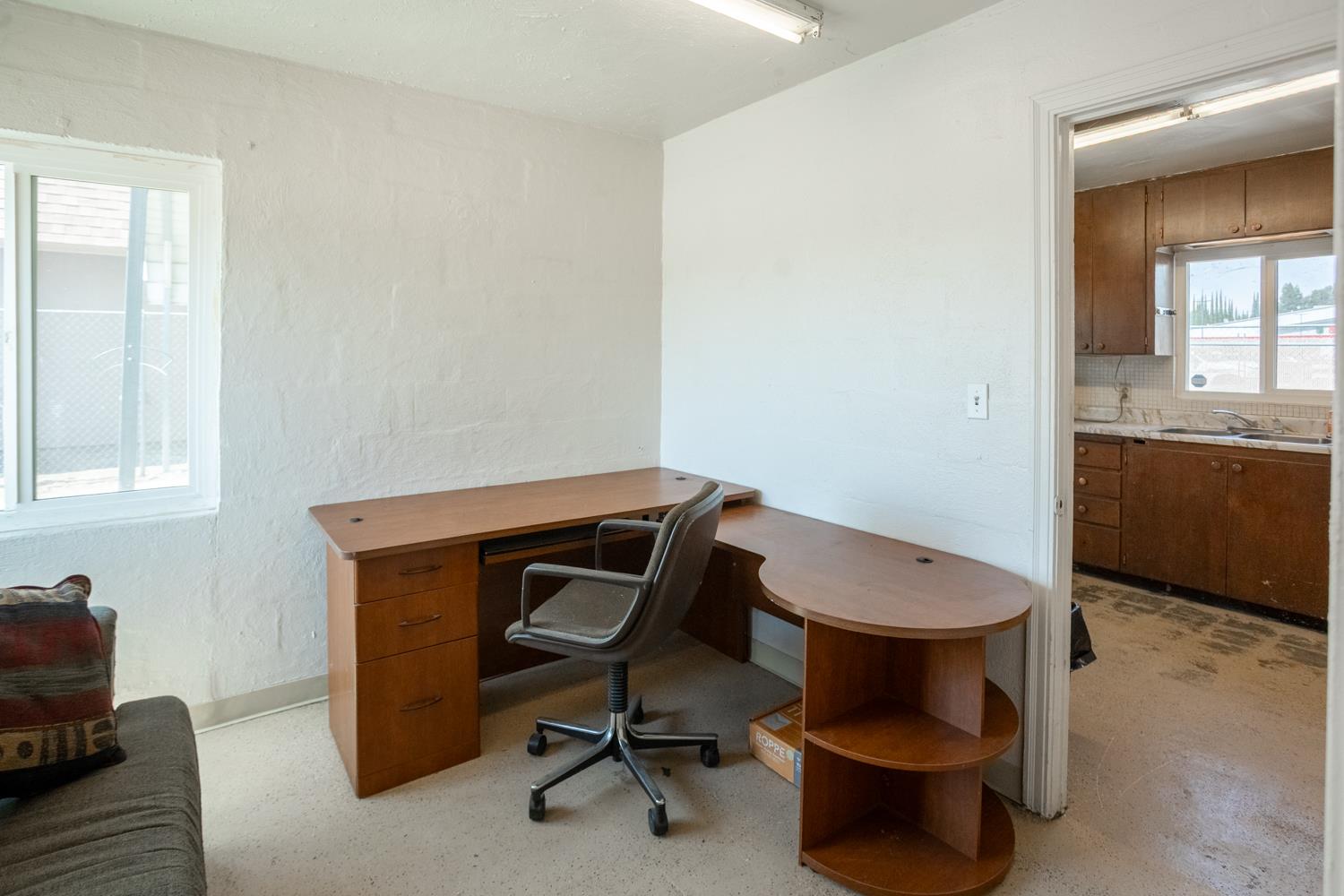 33 East Gridley Road Gridley, CA 95948 - Photo 36 of 53 a view of a workspace with furniture and a window