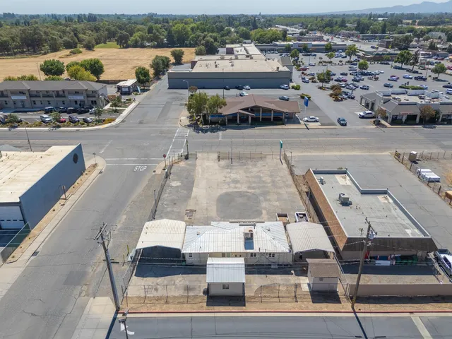 an aerial view of a city with ocean view