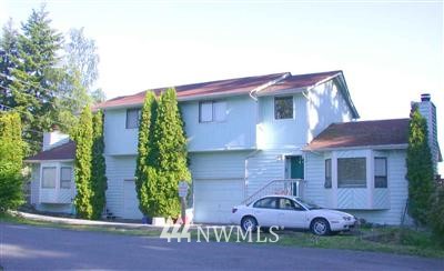 7201 Lower Ridge Road Everett, WA 98203 - Photo 1 of 1 a front view of a house with garden