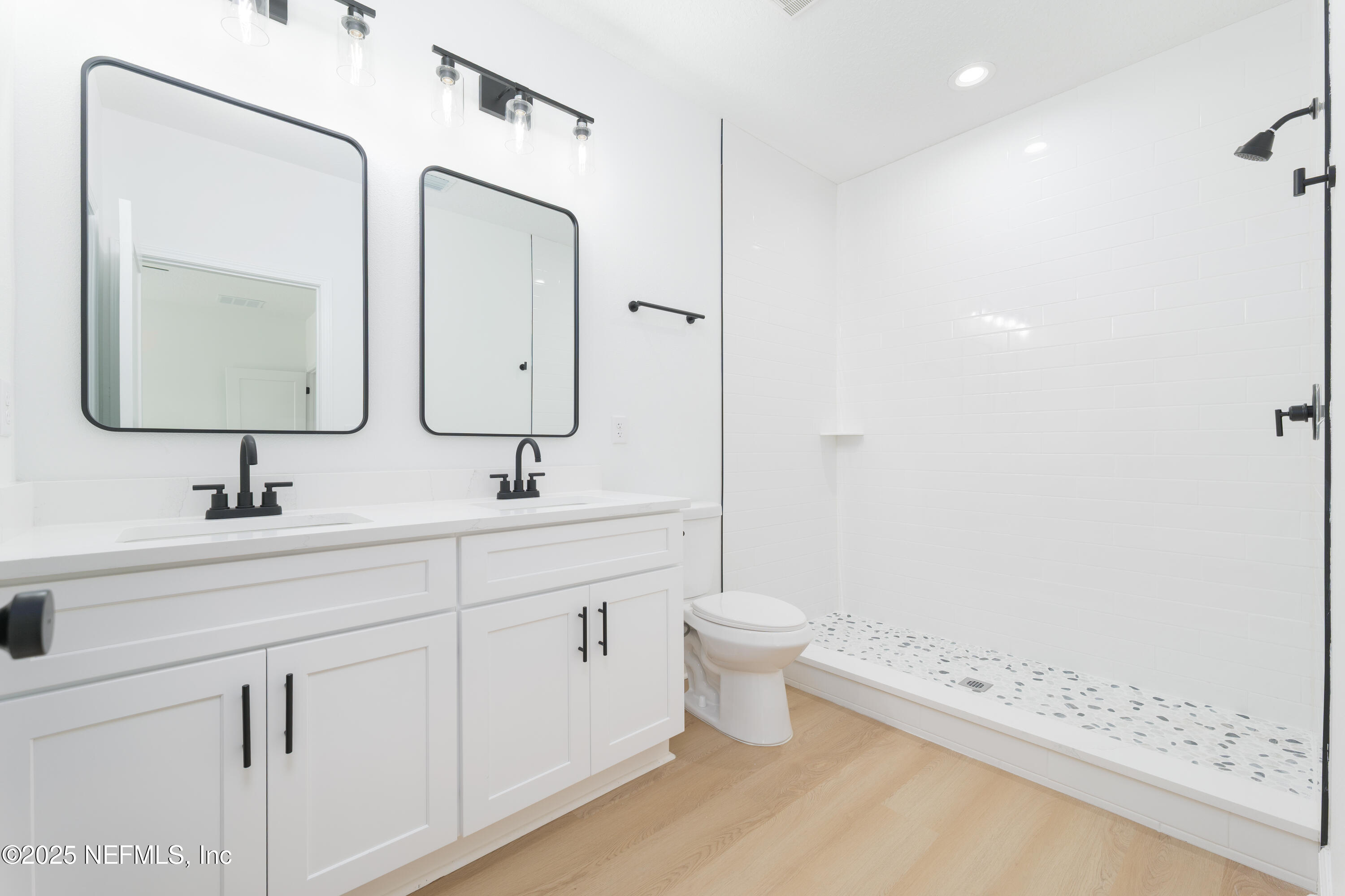 5294 County Road 352 Keystone Heights, FL 32656 - Photo 13 of 23 a bathroom with a toilet a sink a mirror and shower