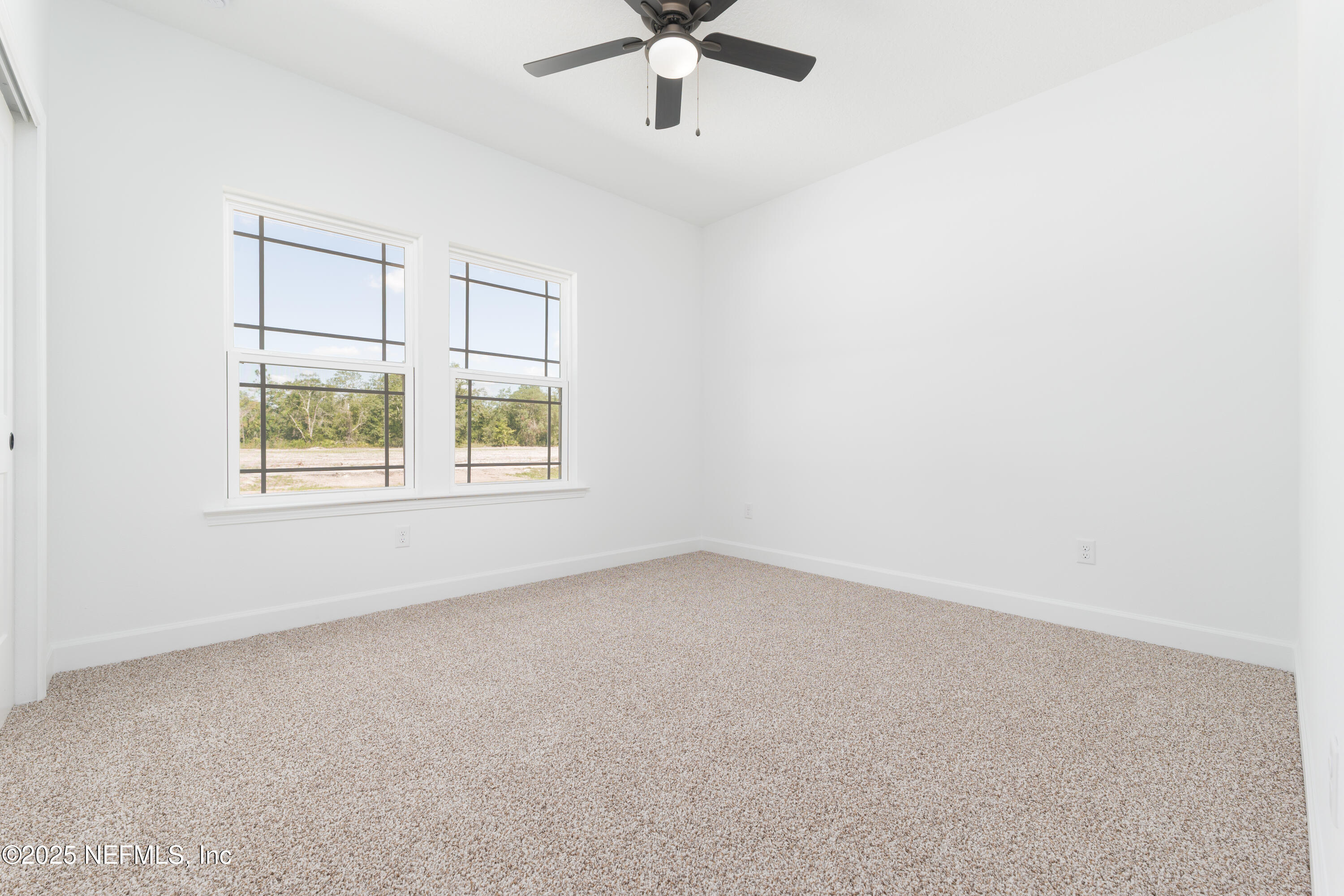 5294 County Road 352 Keystone Heights, FL 32656 - Photo 15 of 23 an empty room with windows and ceiling fan