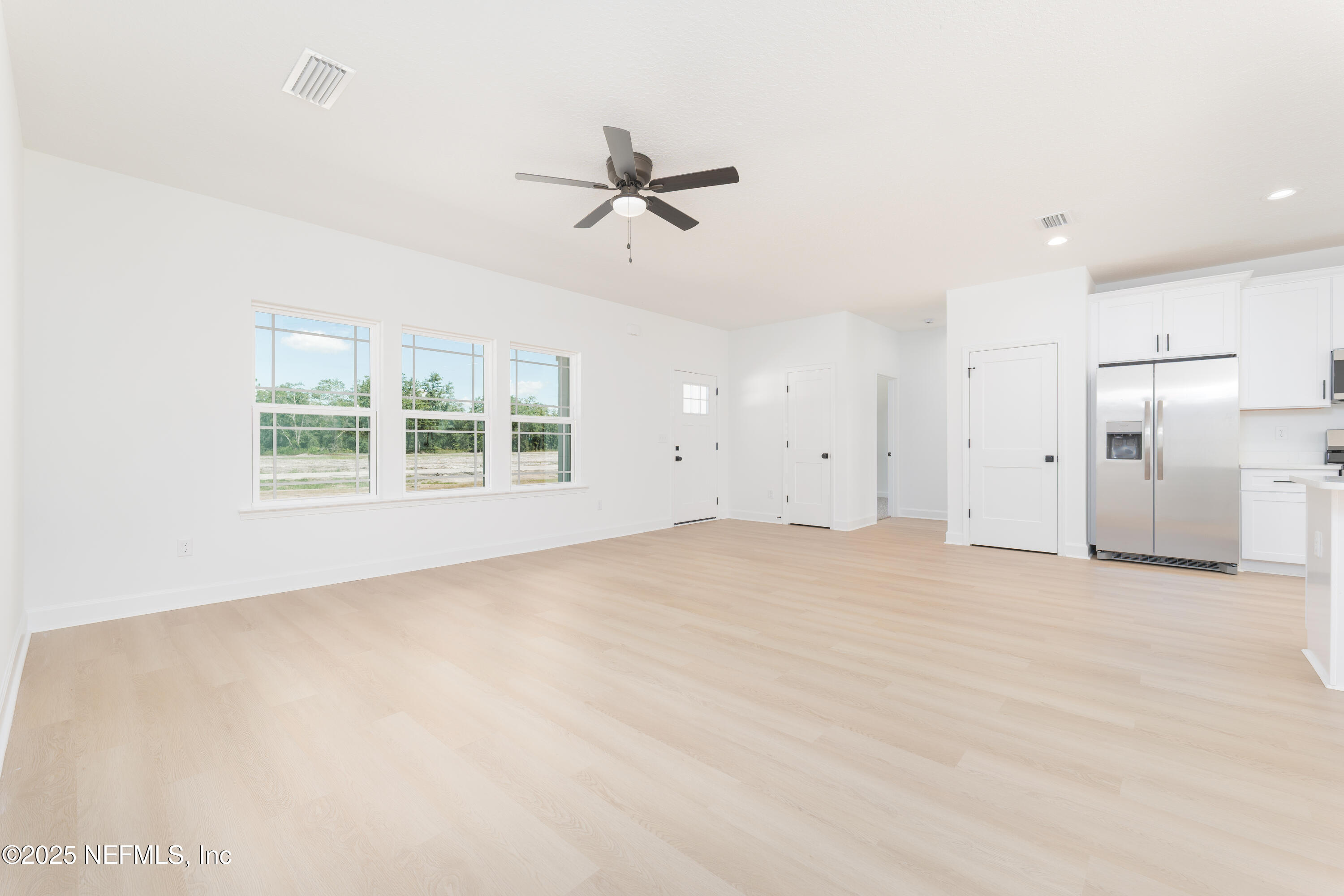 5294 County Road 352 Keystone Heights, FL 32656 - Photo 10 of 23 an empty room with a window and a ceiling fan