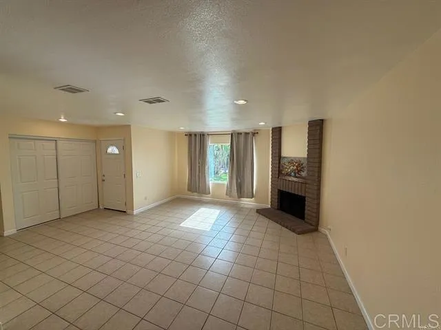 a kitchen with granite countertop a sink stove and cabinets