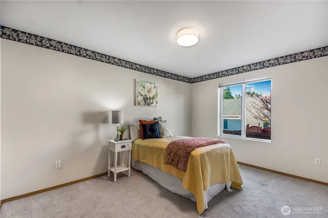 a bedroom with a bed and window