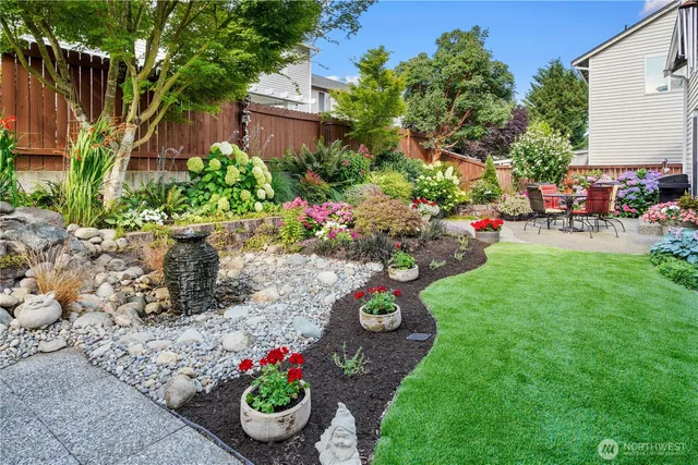 a view of a garden with seating area