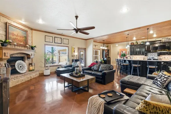 a living room with furniture a rug and a window