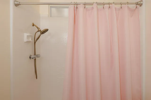 a bathroom with a shower curtain