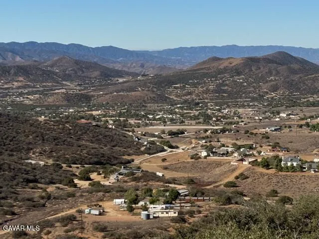 an aerial view of residential house and green space