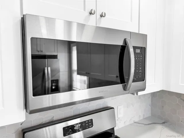 a view of a kitchen with wooden floor and a kitchen