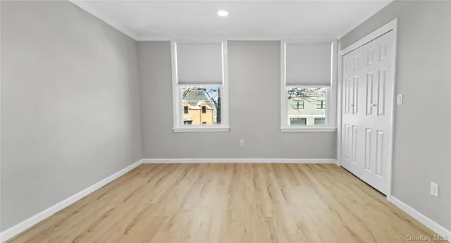a view of room with wooden floor