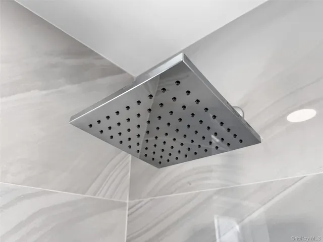 a kitchen with a refrigerator sink and cabinets