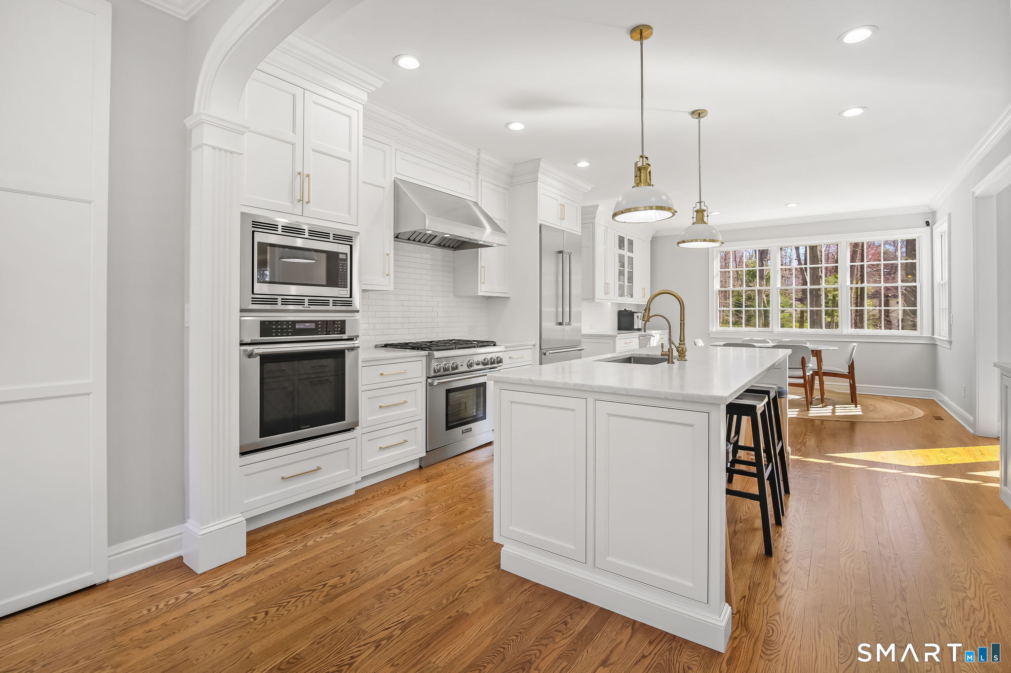 323 Smith Ridge Road New Canaan, CT 06840 - Photo 13 of 39 a kitchen with a stove a sink and a refrigerator