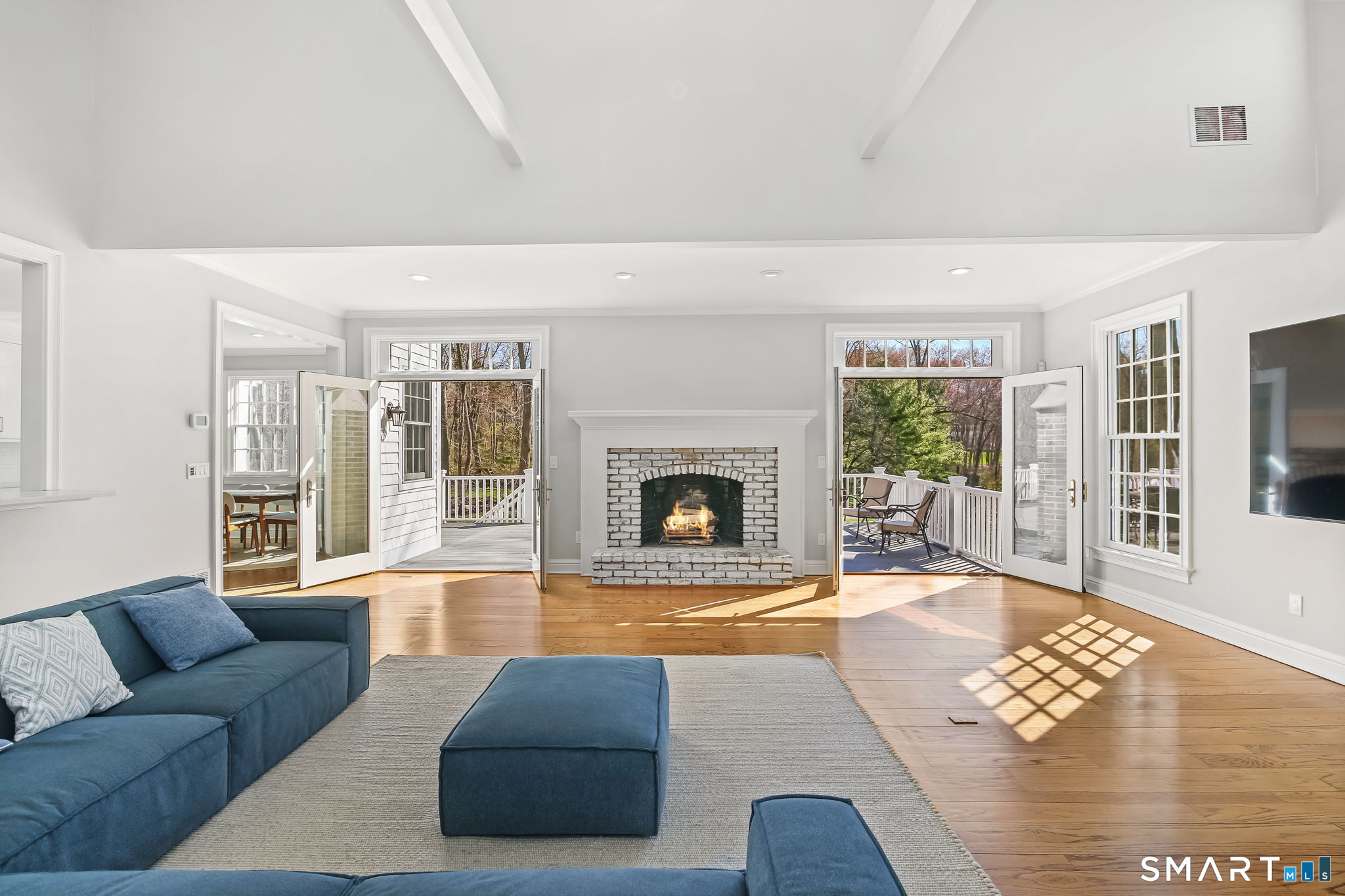 323 Smith Ridge Road New Canaan, CT 06840 - Photo 15 of 39 a living room with furniture and a fireplace