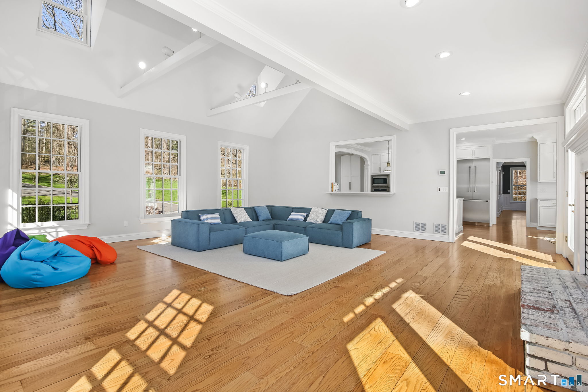 323 Smith Ridge Road New Canaan, CT 06840 - Photo 16 of 39 a bedroom with a bed and glass windows