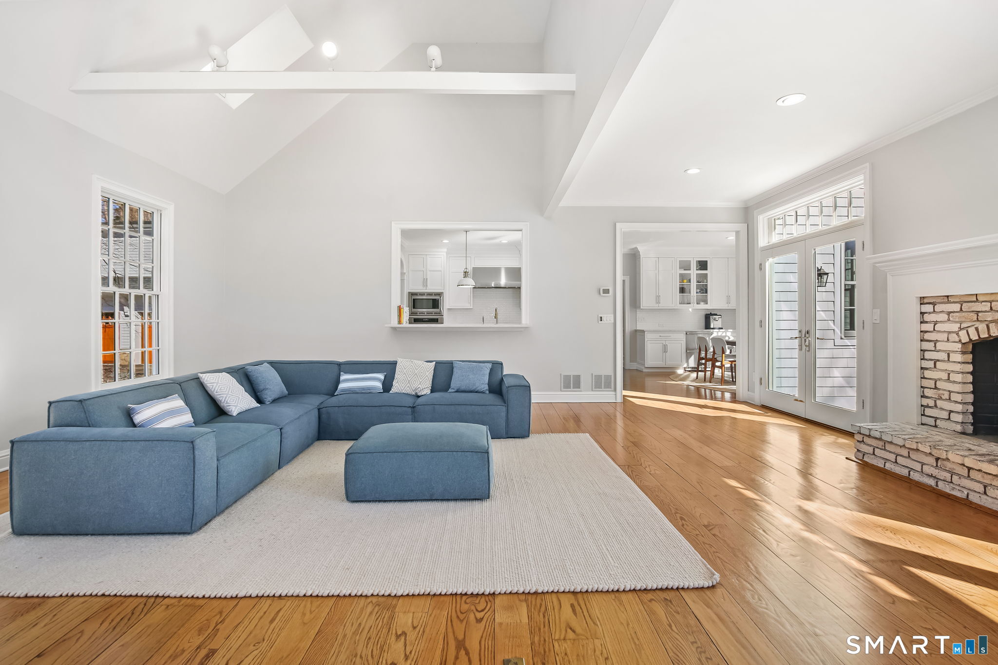 323 Smith Ridge Road New Canaan, CT 06840 - Photo 17 of 39 a living room with furniture and a large window