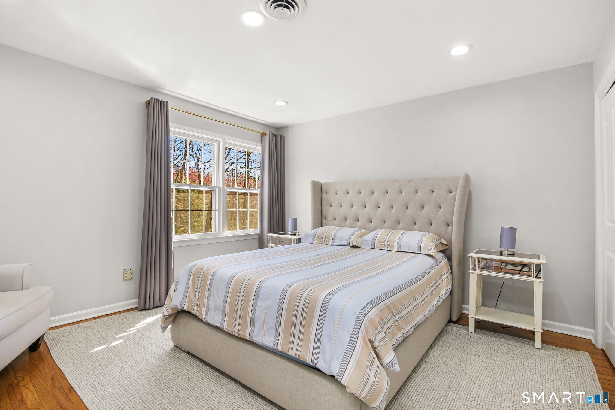 323 Smith Ridge Road New Canaan, CT 06840 - Photo 24 of 39 a bedroom with a bed and a window