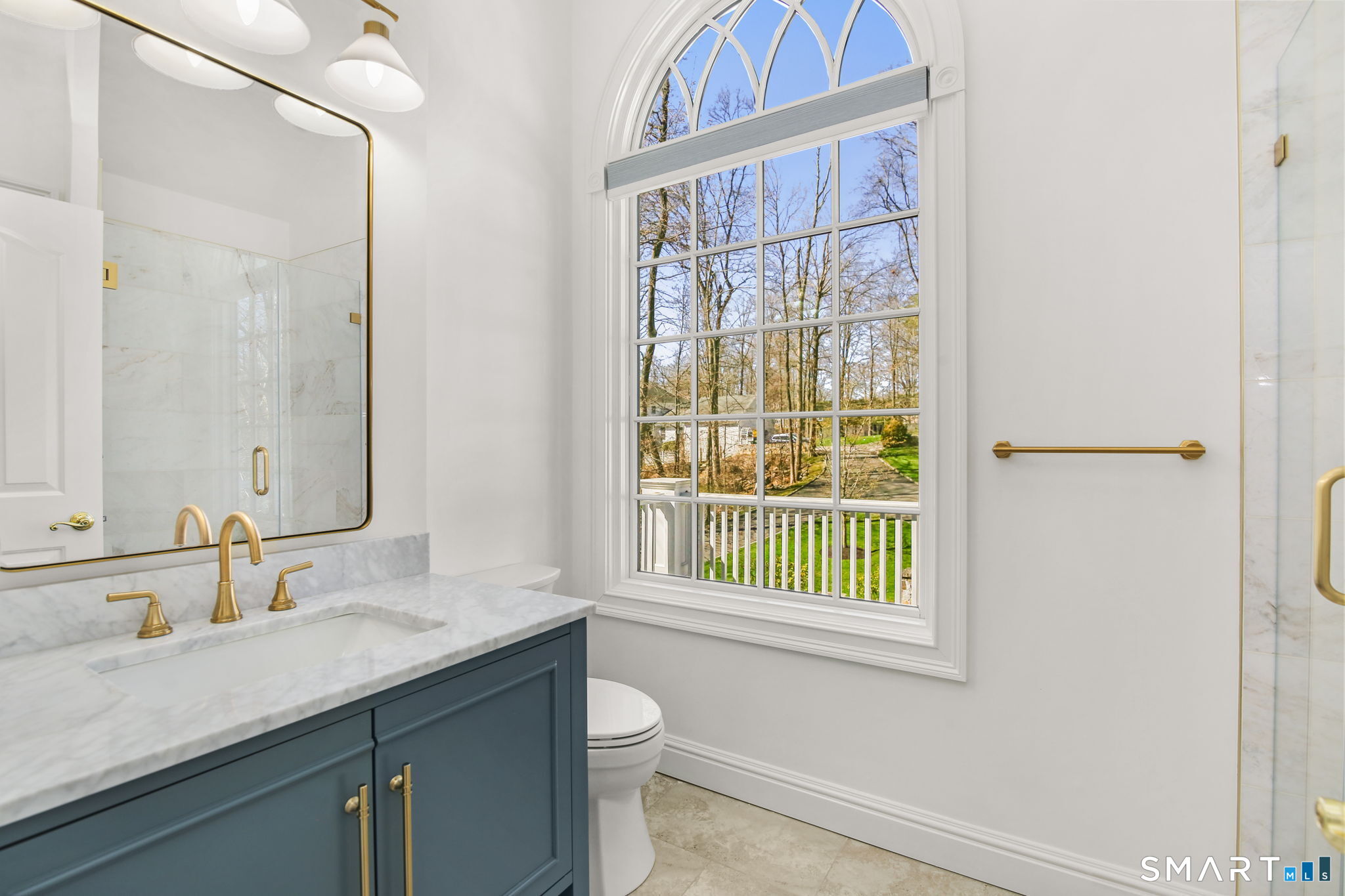 323 Smith Ridge Road New Canaan, CT 06840 - Photo 25 of 39 a bathroom with a sink and a mirror