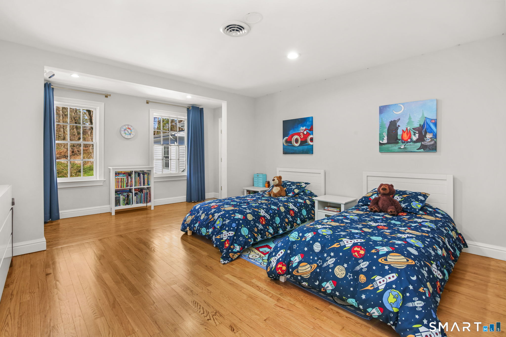 323 Smith Ridge Road New Canaan, CT 06840 - Photo 26 of 39 a bedroom with two beds and a wooden floor