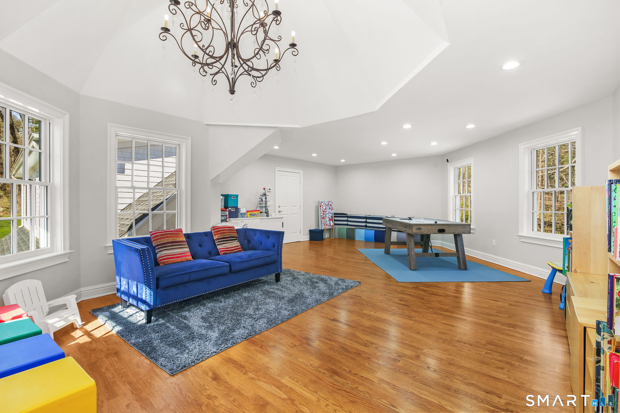 323 Smith Ridge Road New Canaan, CT 06840 - Photo 29 of 39 a living room with furniture and a wooden floor