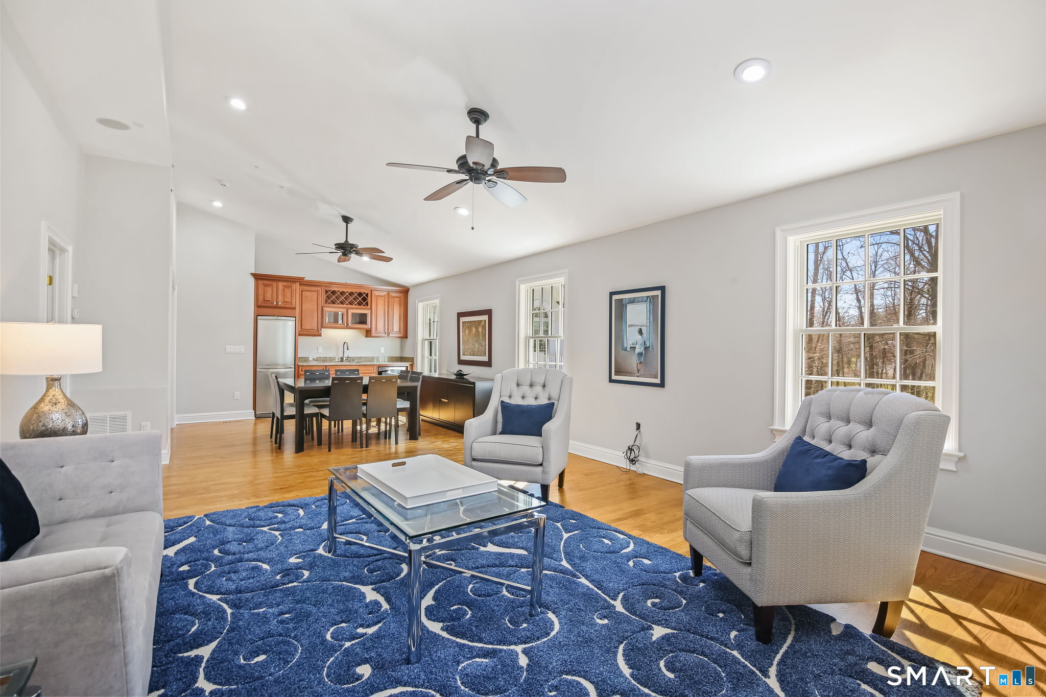 323 Smith Ridge Road New Canaan, CT 06840 - Photo 31 of 39 a living room with furniture a rug and a window