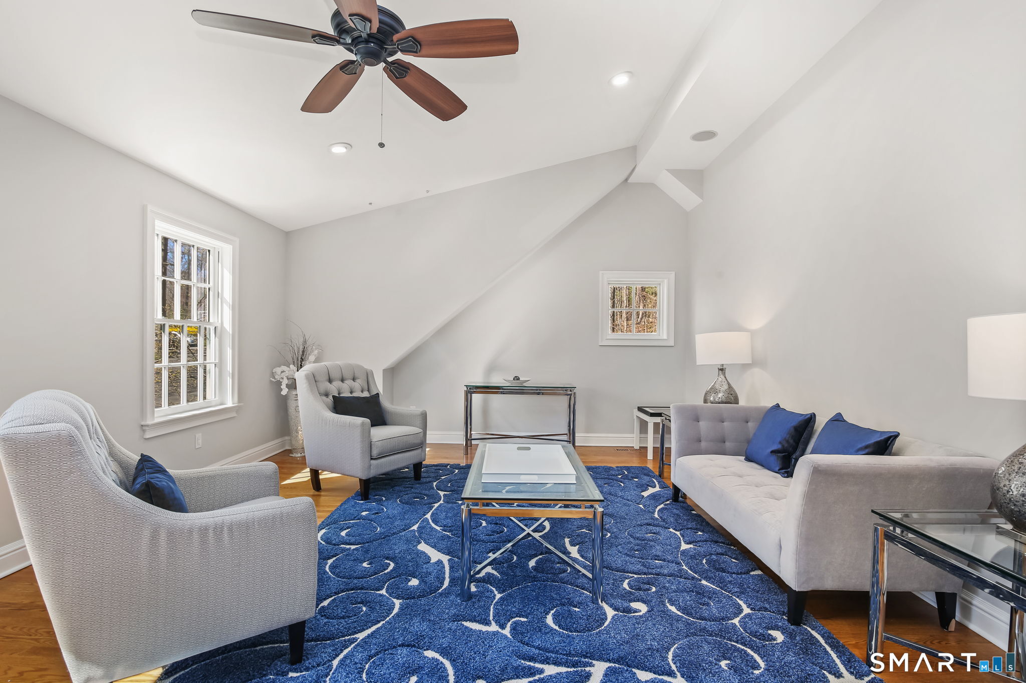 323 Smith Ridge Road New Canaan, CT 06840 - Photo 32 of 39 a living room with furniture and a window