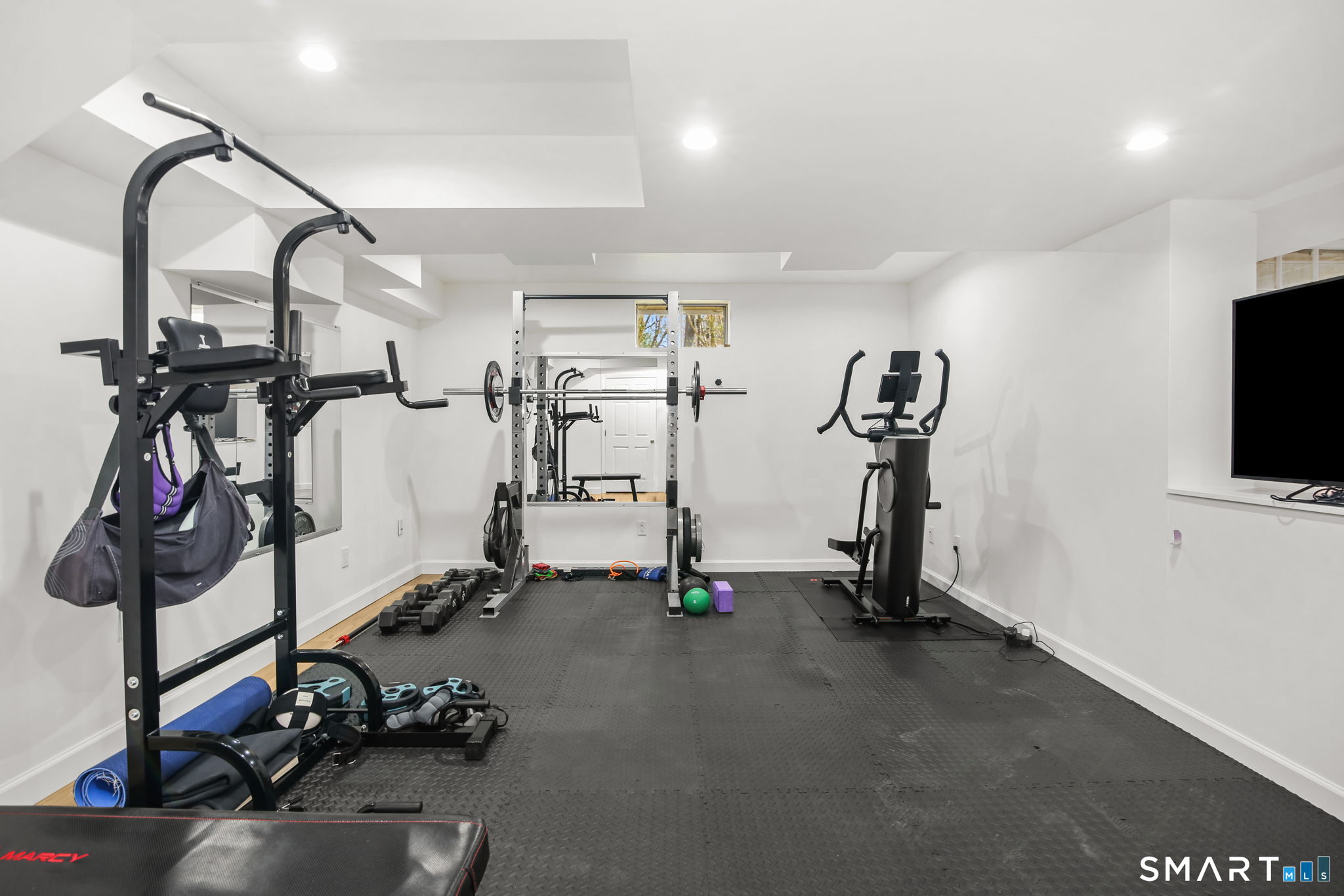 323 Smith Ridge Road New Canaan, CT 06840 - Photo 35 of 39 a view of a room with gym equipment