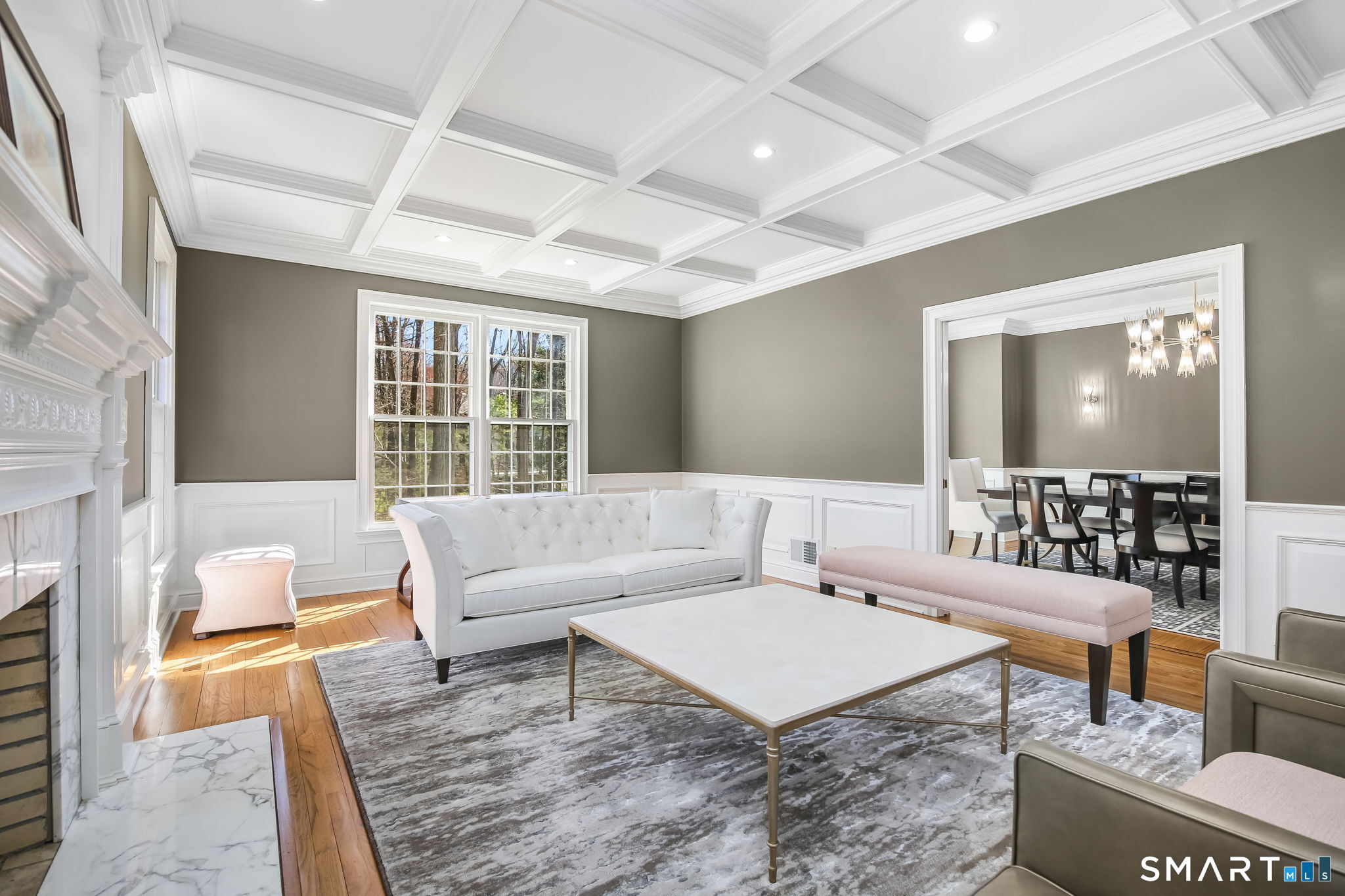 323 Smith Ridge Road New Canaan, CT 06840 - Photo 5 of 39 a living room with furniture and a large window